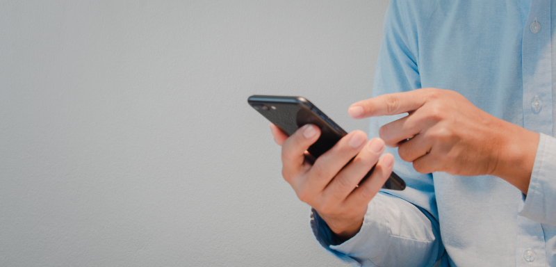 A man using a cellphone.